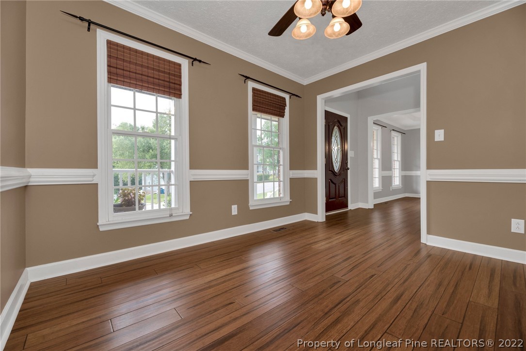 338 Lionshead Road Fayetteville, NC 28311 - Photo 7 of 39 a view of an empty room with wooden floor and a window