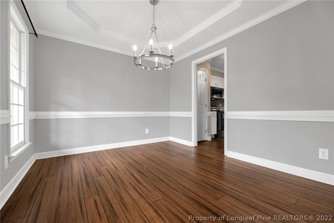 338 Lionshead Road Fayetteville, NC 28311 - Photo 8 of 39 wooden floor in an empty room with a window