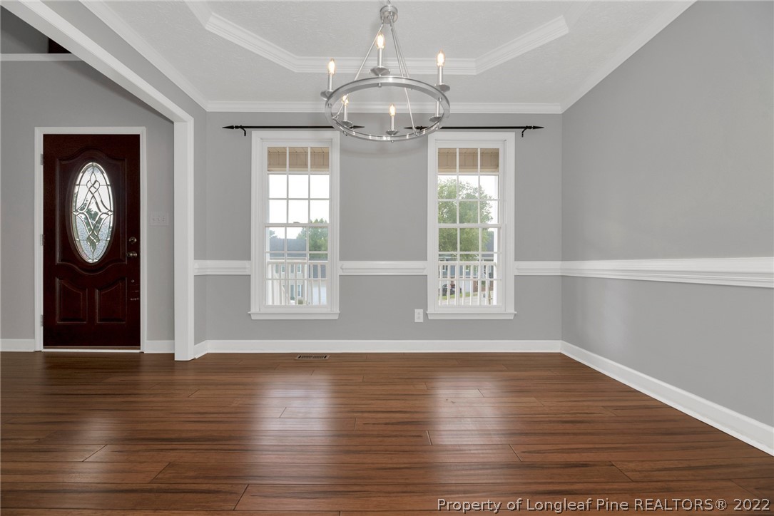338 Lionshead Road Fayetteville, NC 28311 - Photo 9 of 39 a view of an empty room with wooden floor and a window
