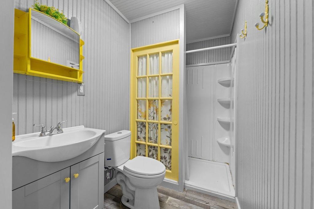 235 Hardeman Street Grand Junction, TN 38039 - Photo 12 of 20 a bathroom with a sink a toilet and shower