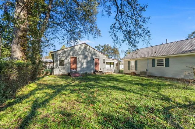 a house view with a backyard space