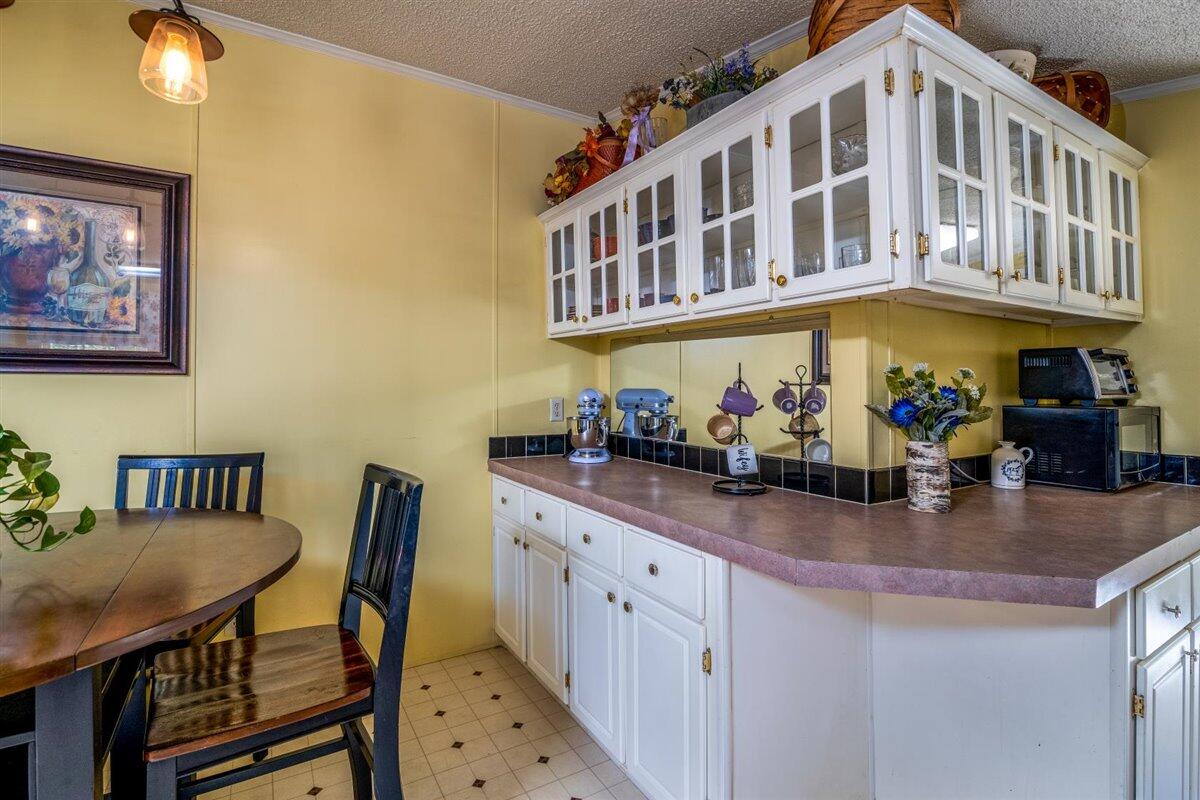 10 Tolley Road Hardy, VA 24101 - Photo 12 of 25 a kitchen with a table chairs stove and cabinets