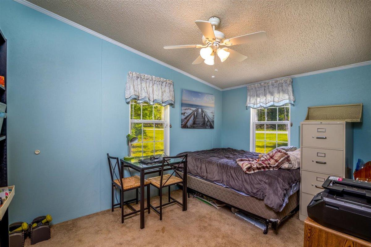10 Tolley Road Hardy, VA 24101 - Photo 20 of 25 a bedroom with a bed and a chandelier