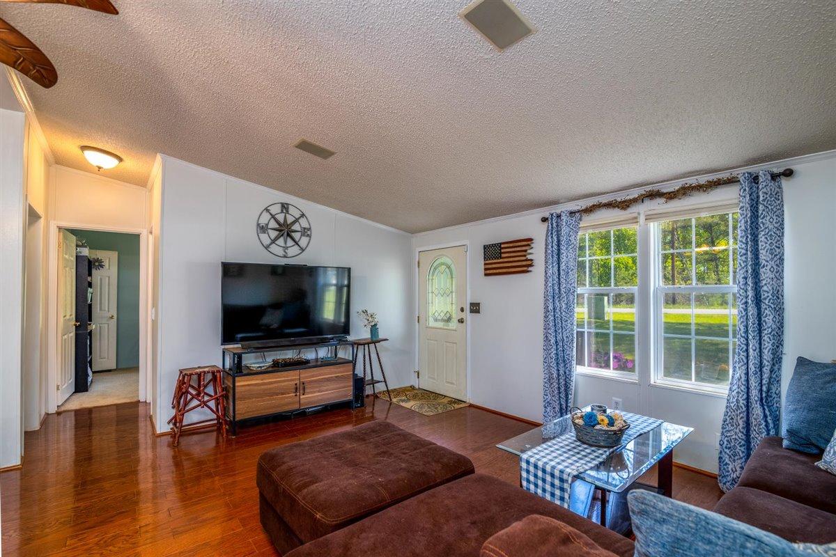 10 Tolley Road Hardy, VA 24101 - Photo 3 of 25 a living room with furniture and a flat screen tv