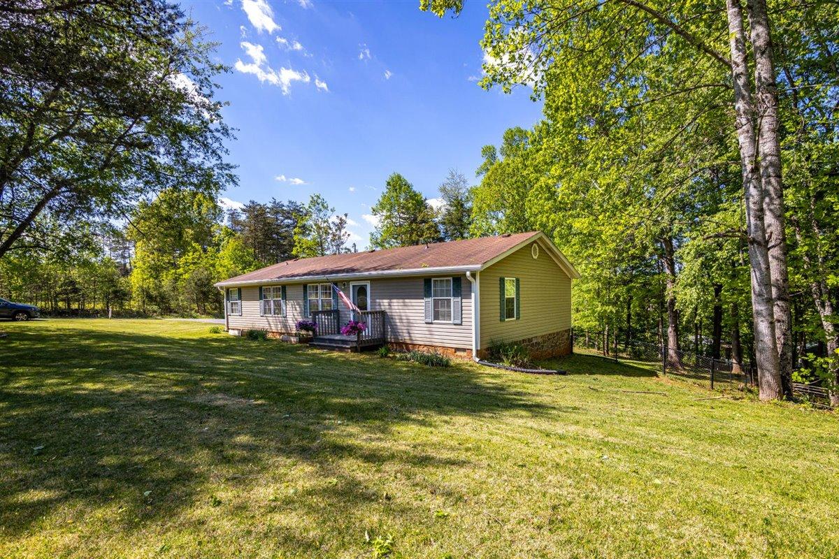 10 Tolley Road Hardy, VA 24101 - Photo 21 of 25 a view of a house with a big yard and a large tree