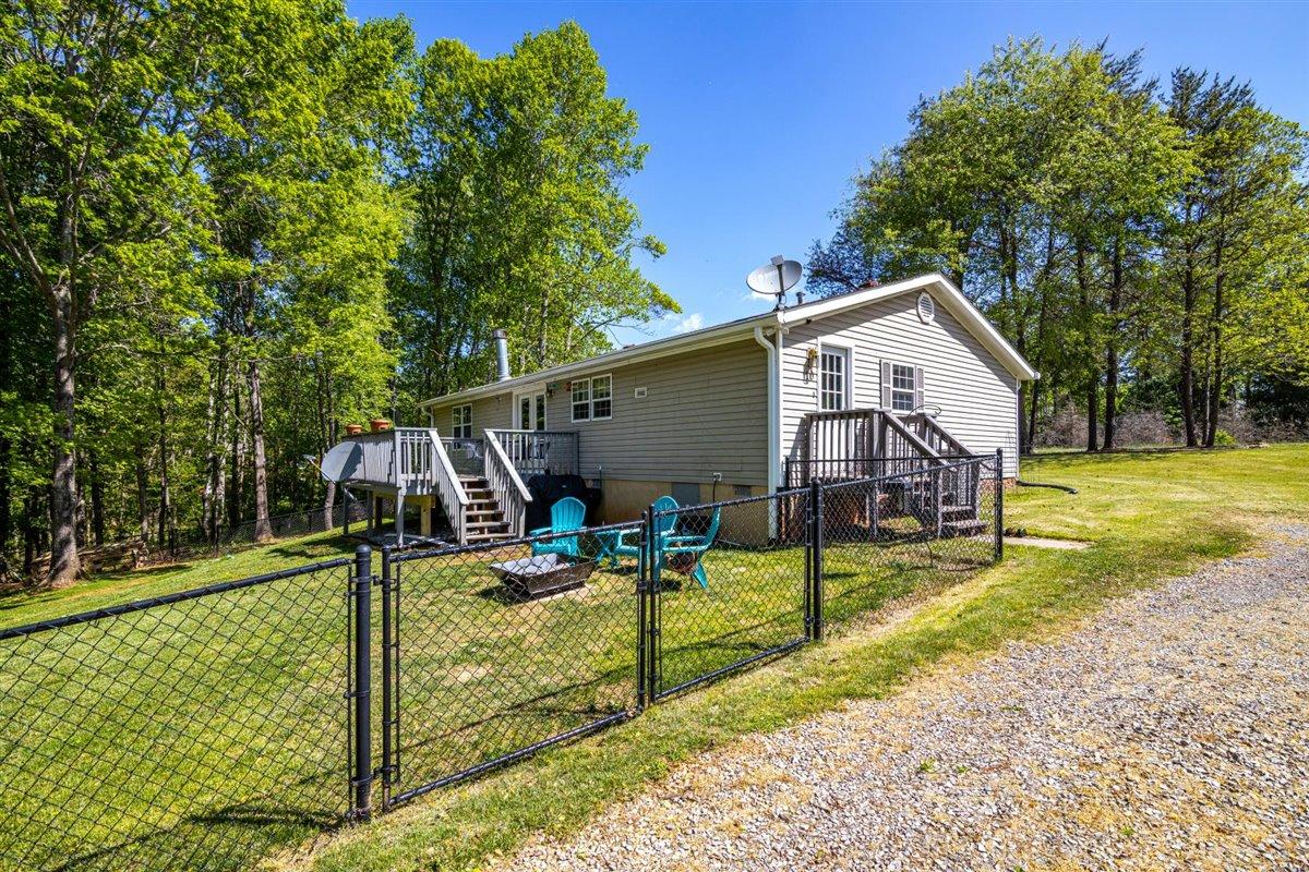 10 Tolley Road Hardy, VA 24101 - Photo 22 of 25 a view of a house with backyard and wooden fence