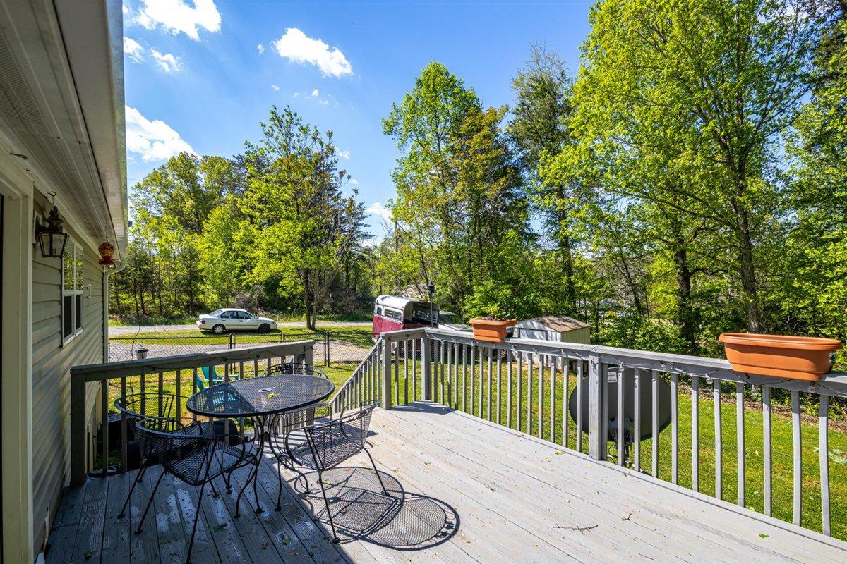 10 Tolley Road Hardy, VA 24101 - Photo 8 of 25 a balcony with wooden floor table and chairs