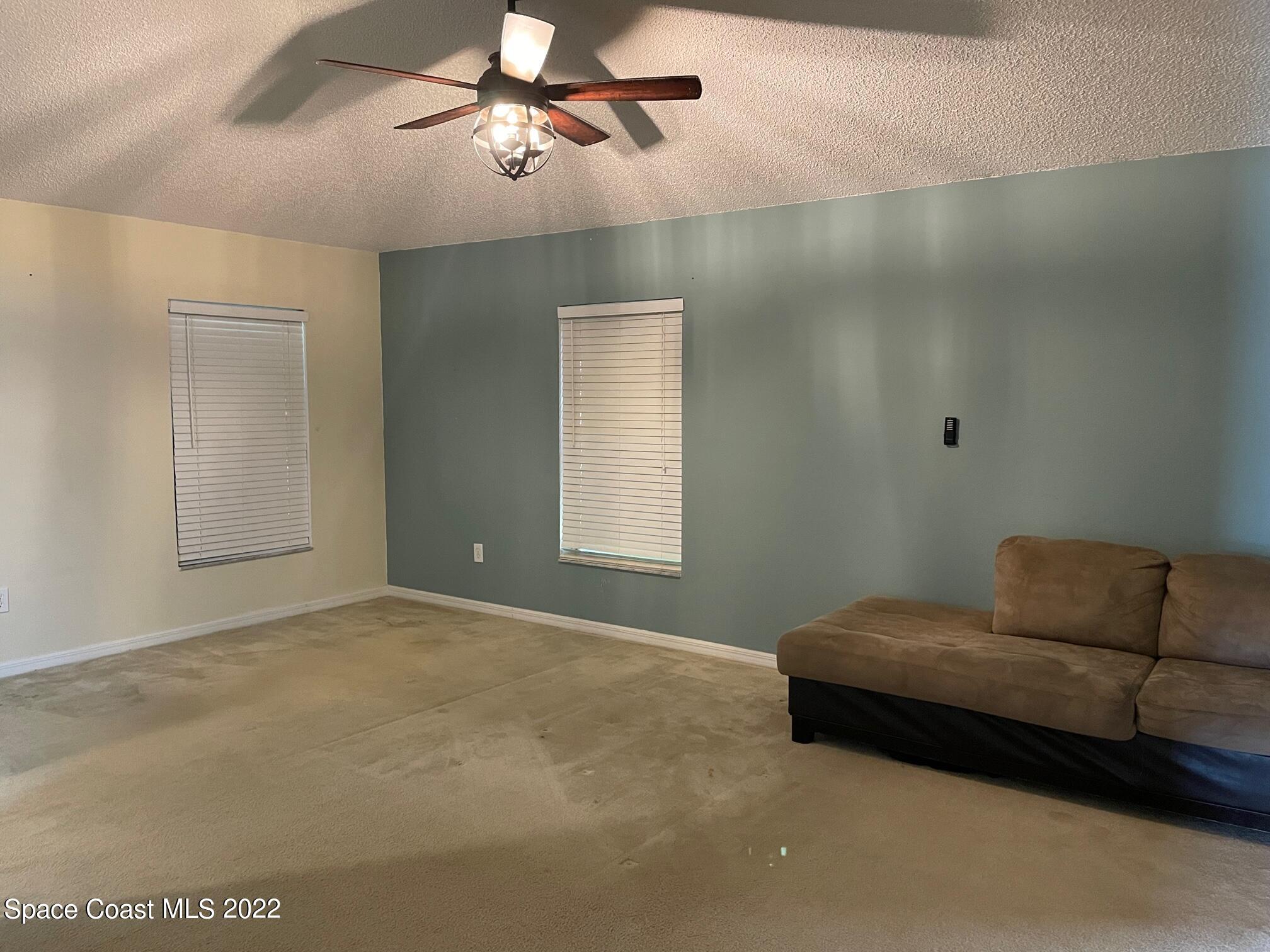 701 Lavender Street Southeast Palm Bay, FL 32909 - Photo 13 of 34 Primary Bedroom