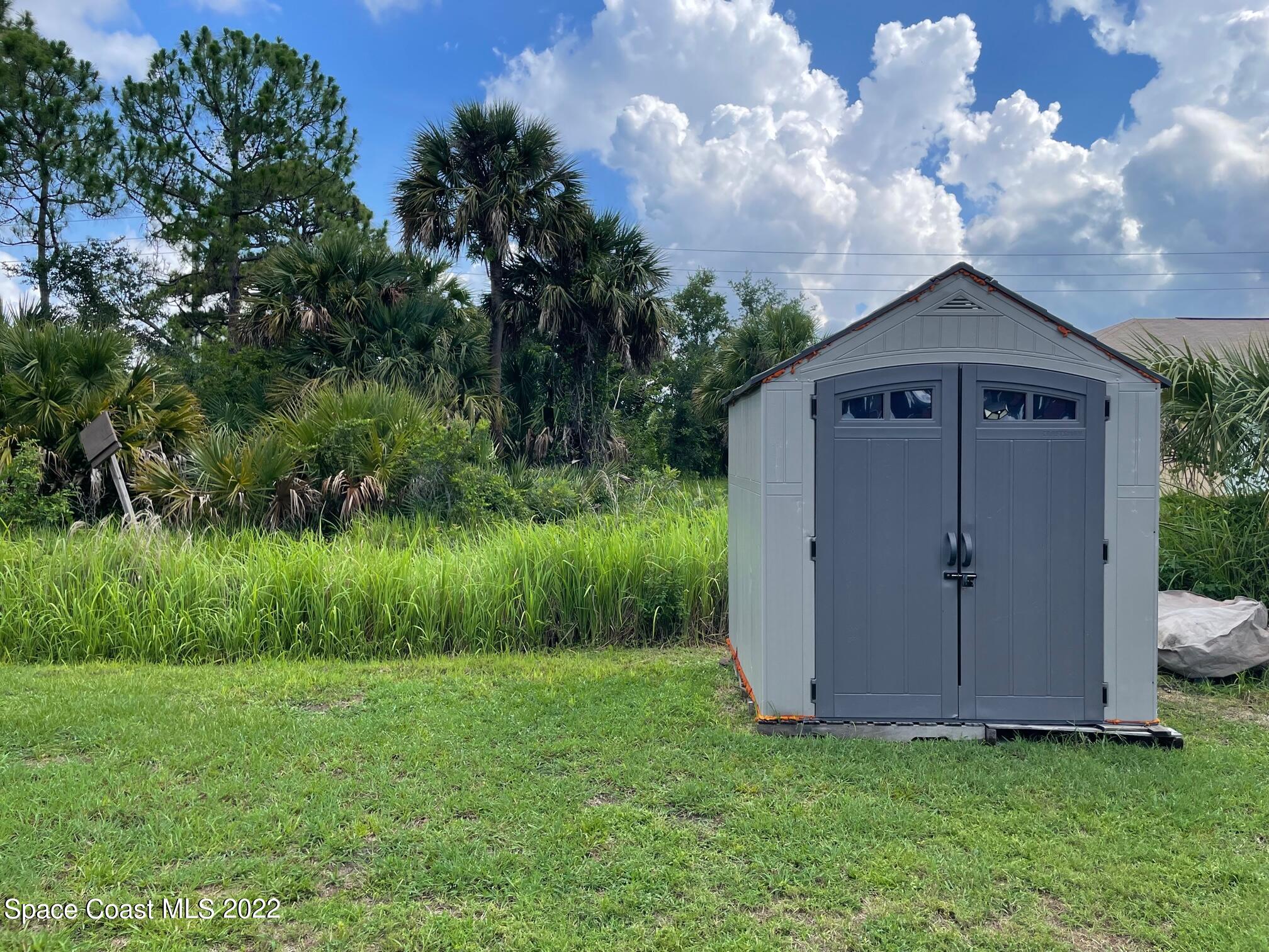701 Lavender Street Southeast Palm Bay, FL 32909 - Photo 30 of 34 Plastic Shed can be removed