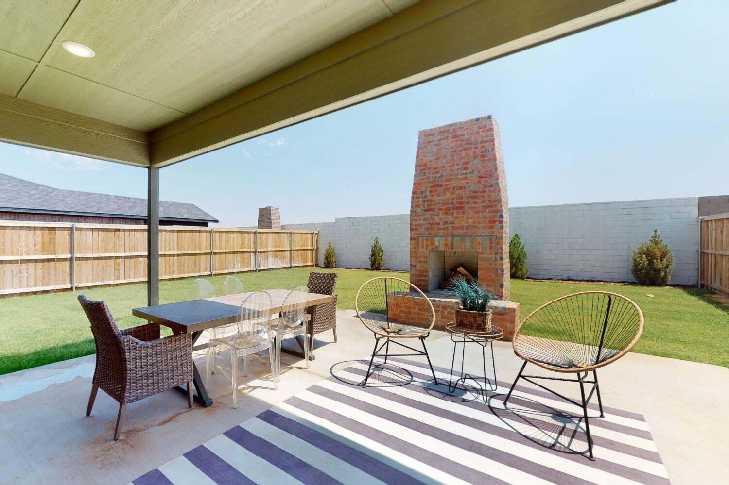3617 128th Street Lubbock, TX 79423 - Photo 26 of 30 a balcony with furniture and a fireplace
