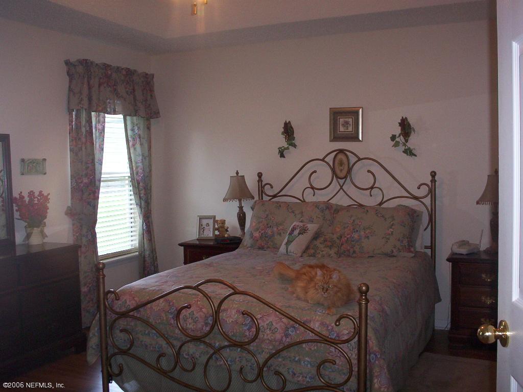 1649 Redstone Court St. Augustine, FL 32092 - Photo 3 of 4 a bedroom with a bed and a window