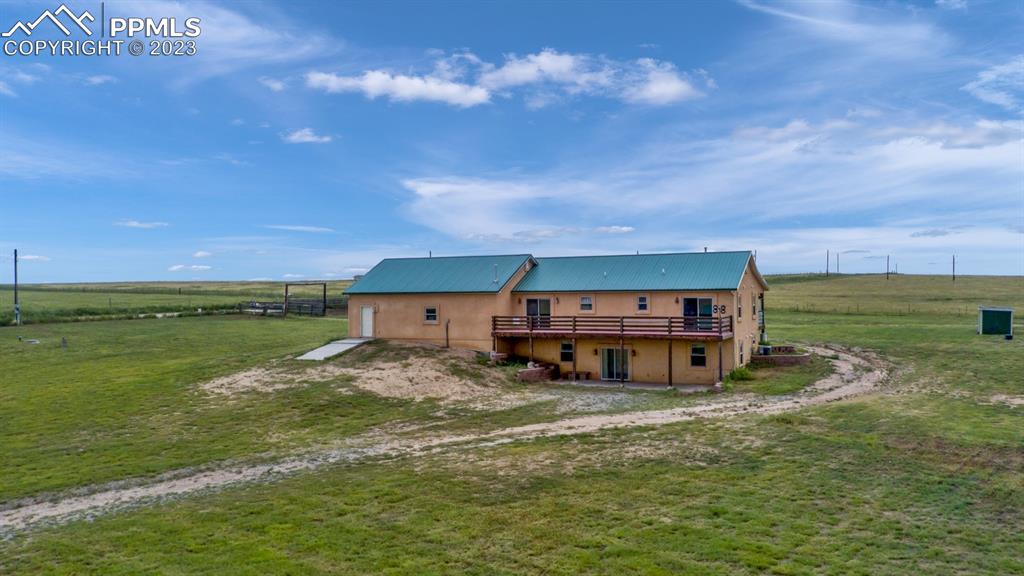 1260 County Road South Rush, CO 80833 - Photo 5 of 50 a house view with a big yard