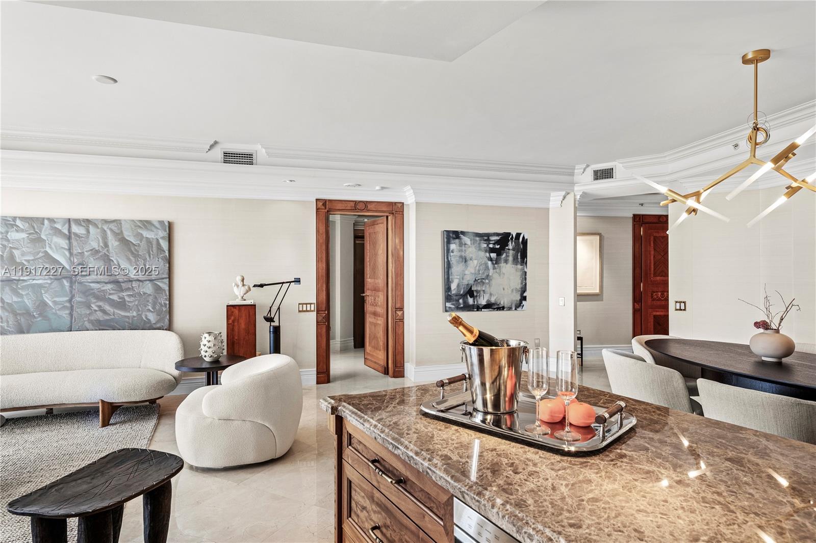 808 Brickell Key Drive, Unit 1802 Miami, FL 33131 - Photo 19 of 43 a living room with furniture and wooden floor