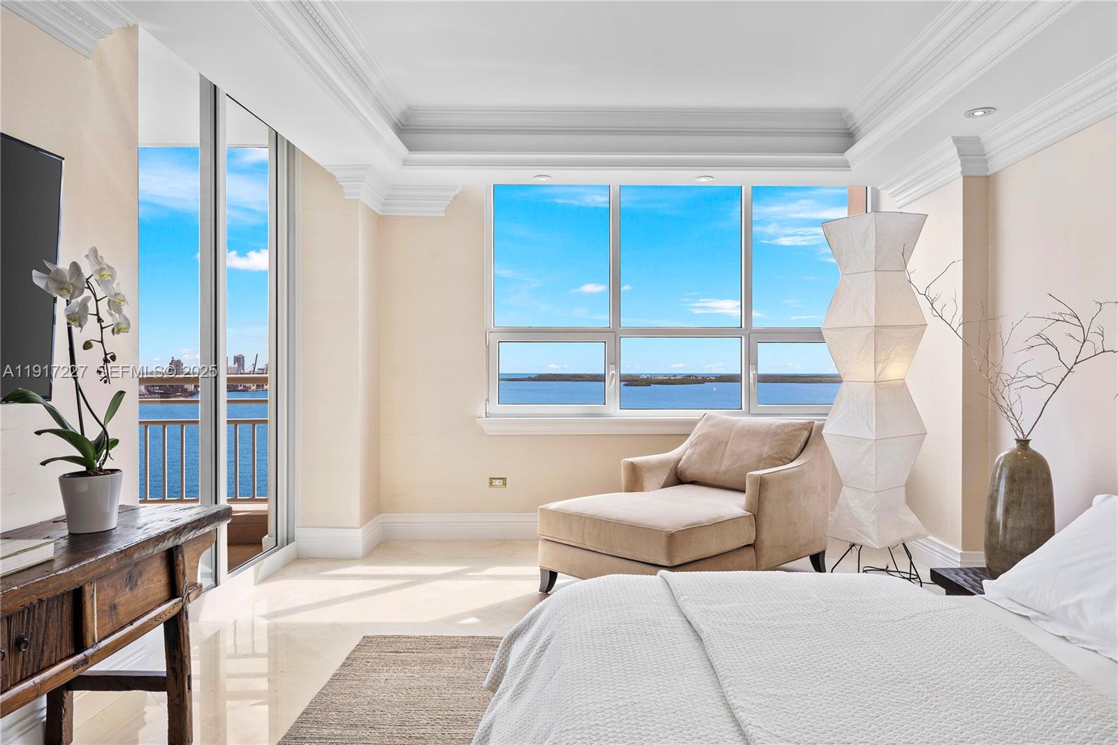 808 Brickell Key Drive, Unit 1802 Miami, FL 33131 - Photo 21 of 43 a bedroom with furniture and a large window