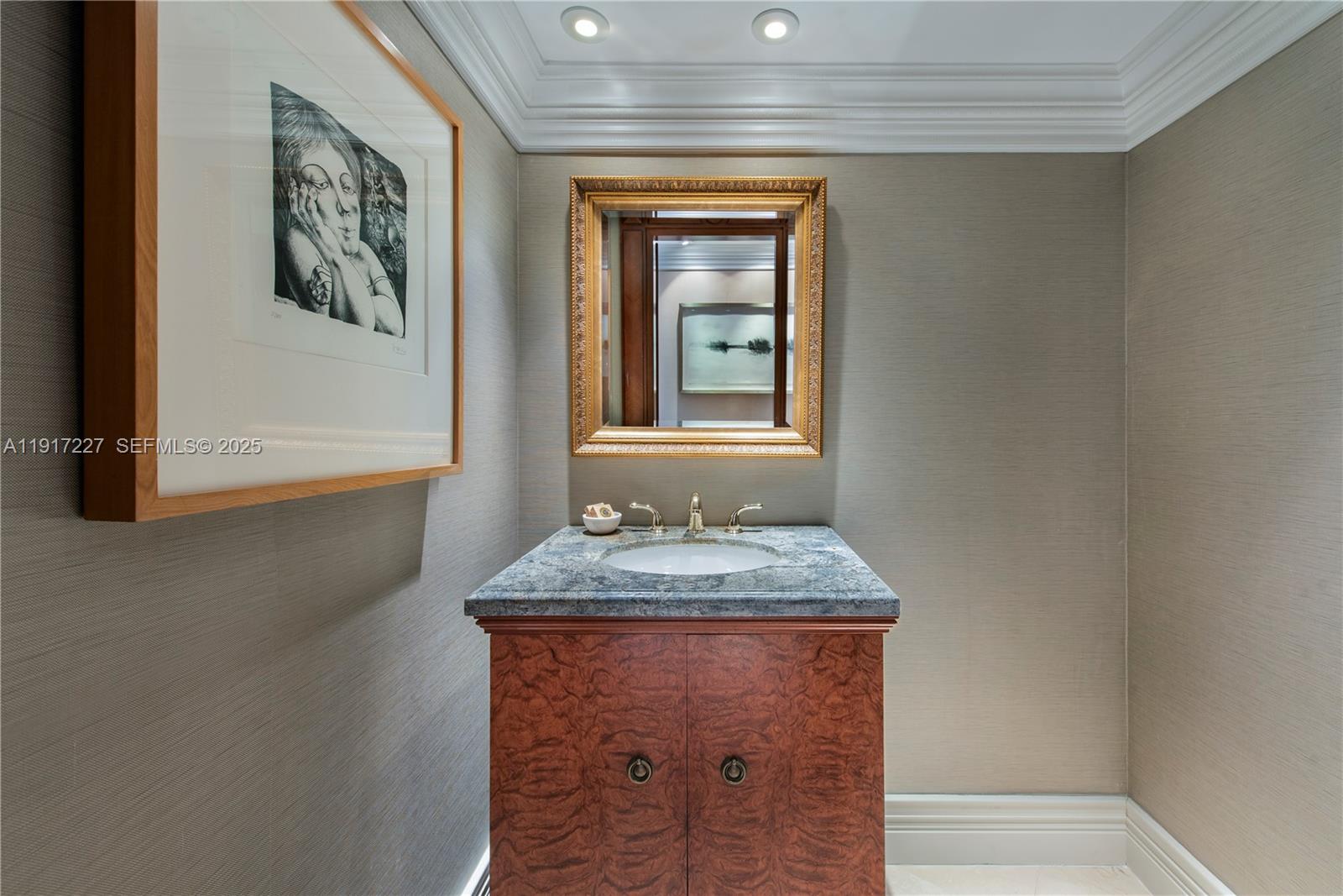 808 Brickell Key Drive, Unit 1802 Miami, FL 33131 - Photo 30 of 43 a bathroom with a granite countertop sink and a window