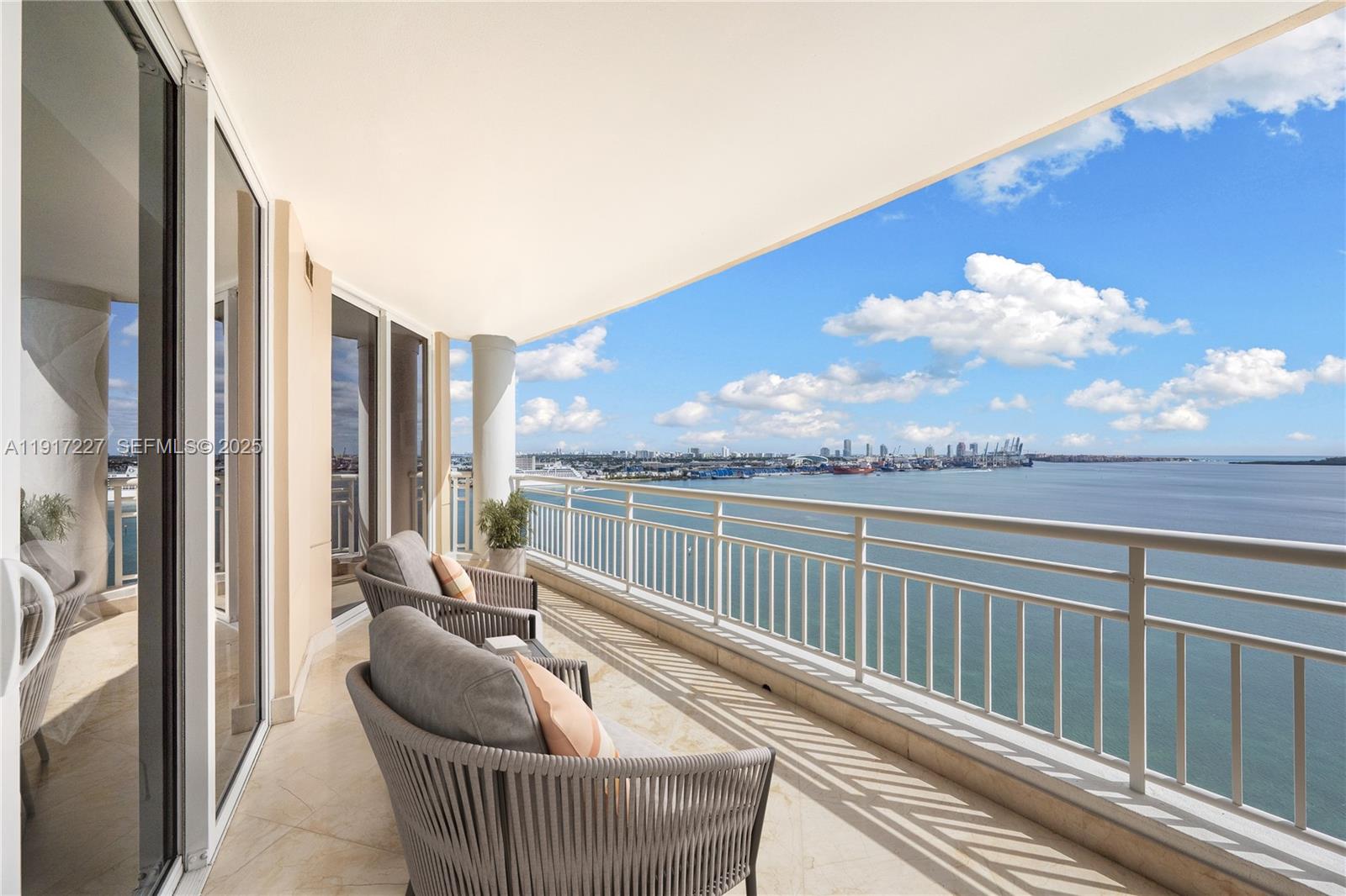 808 Brickell Key Drive, Unit 1802 Miami, FL 33131 - Photo 6 of 43 a balcony with furniture