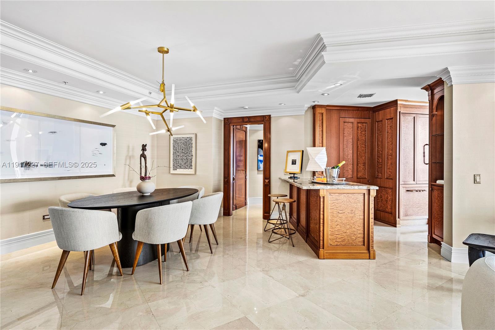 808 Brickell Key Drive, Unit 1802 Miami, FL 33131 - Photo 10 of 43 a view of a dining room with furniture and chandelier