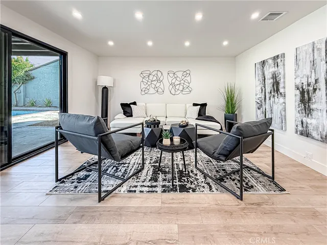 a living room with furniture and a window