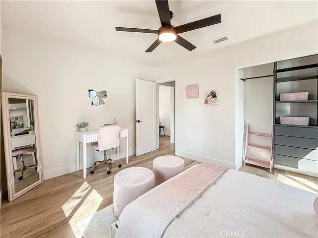 a bedroom with a bed and a view of bathroom