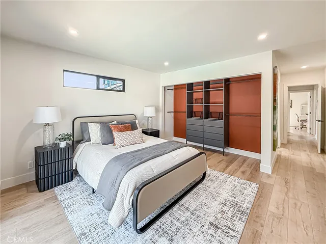 a bedroom with a bed and a walk in closet