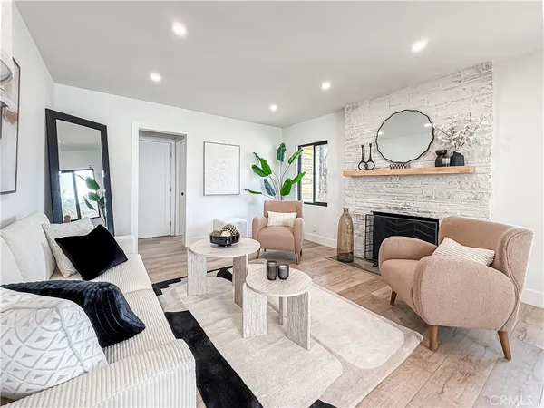 a living room with furniture and a fireplace
