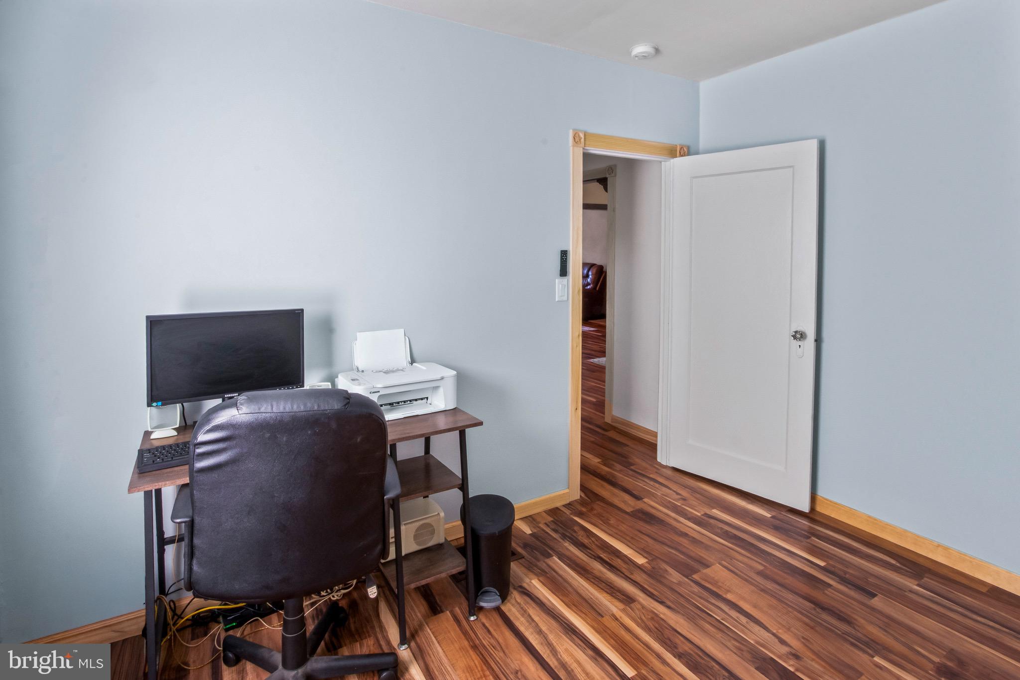 10 South Hook Road Pennsville, NJ 08070 - Photo 19 of 40 a view of a workspace with furniture and wooden floor