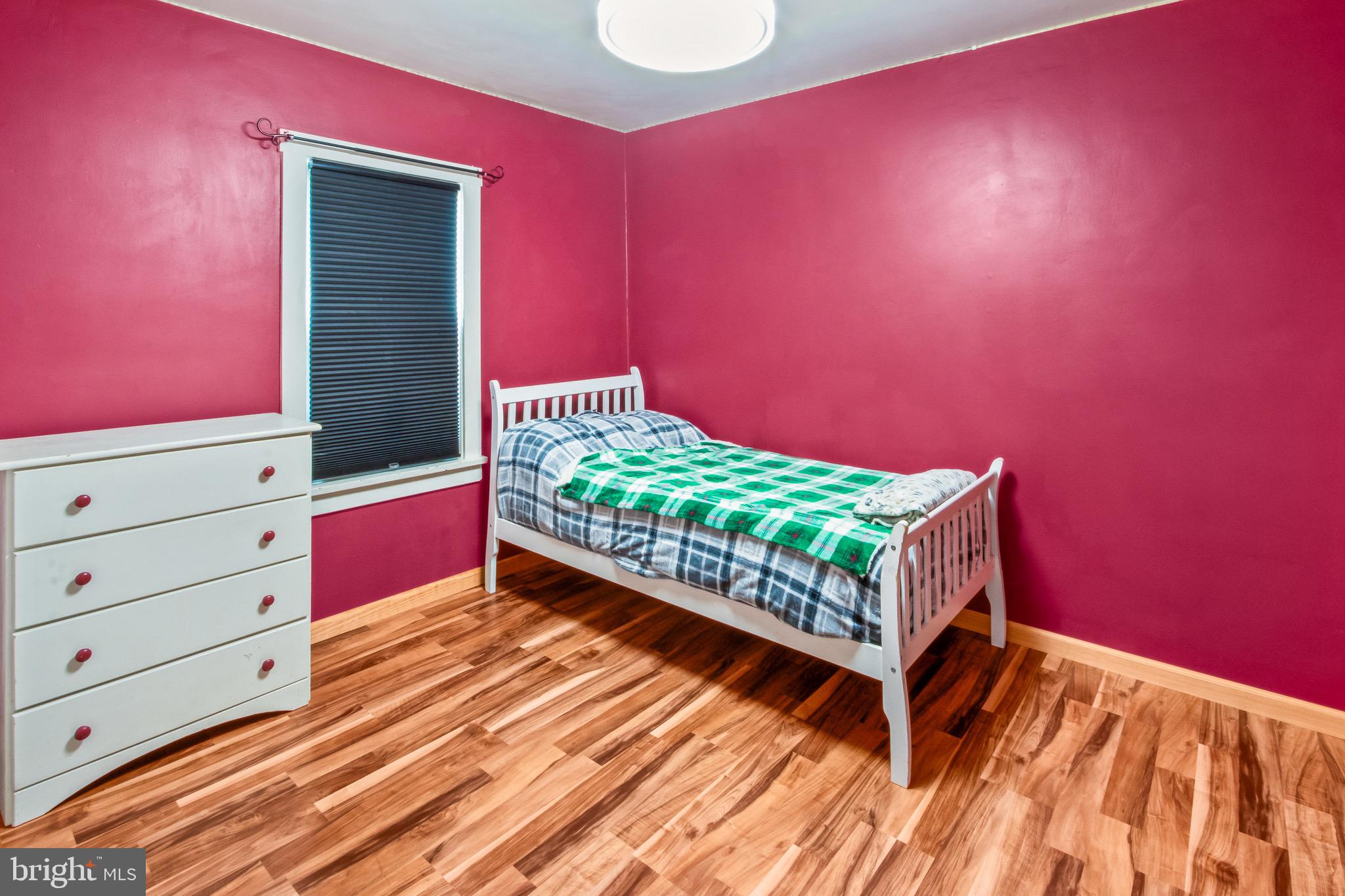 10 South Hook Road Pennsville, NJ 08070 - Photo 23 of 40 a bed room with a bed and a dresser