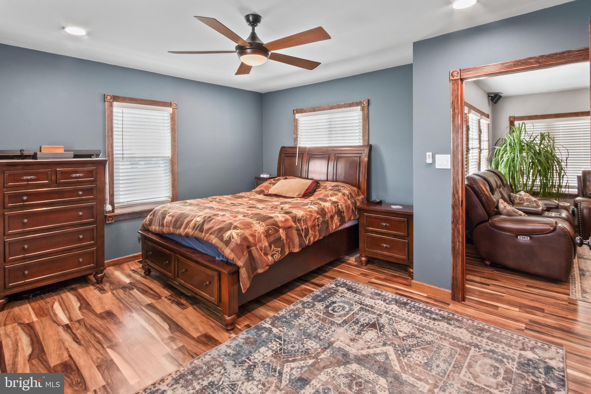 10 South Hook Road Pennsville, NJ 08070 - Photo 25 of 40 a bedroom with a bed and a chandelier