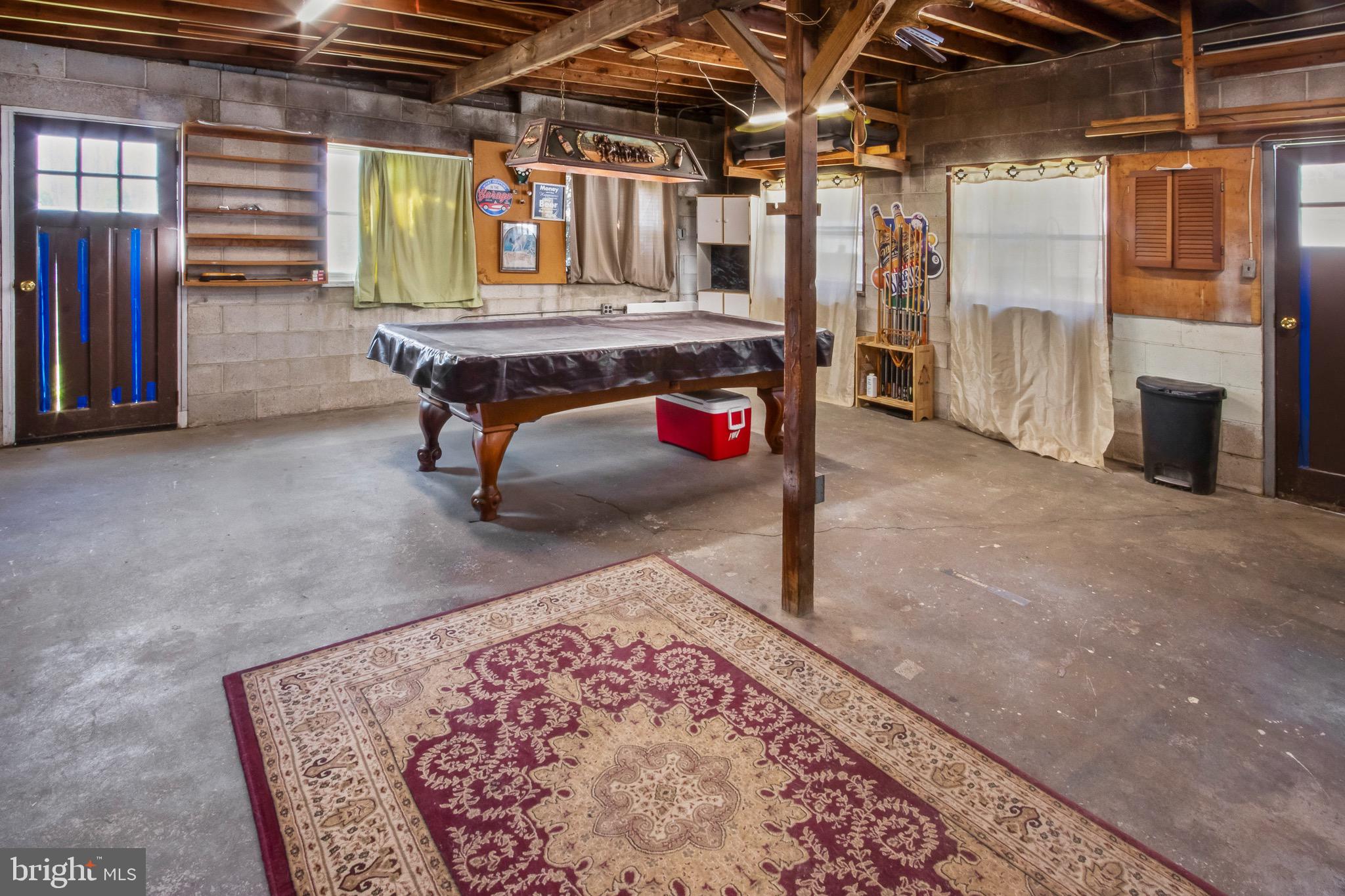 10 South Hook Road Pennsville, NJ 08070 - Photo 33 of 40 a living room with furniture pool table and a fireplace