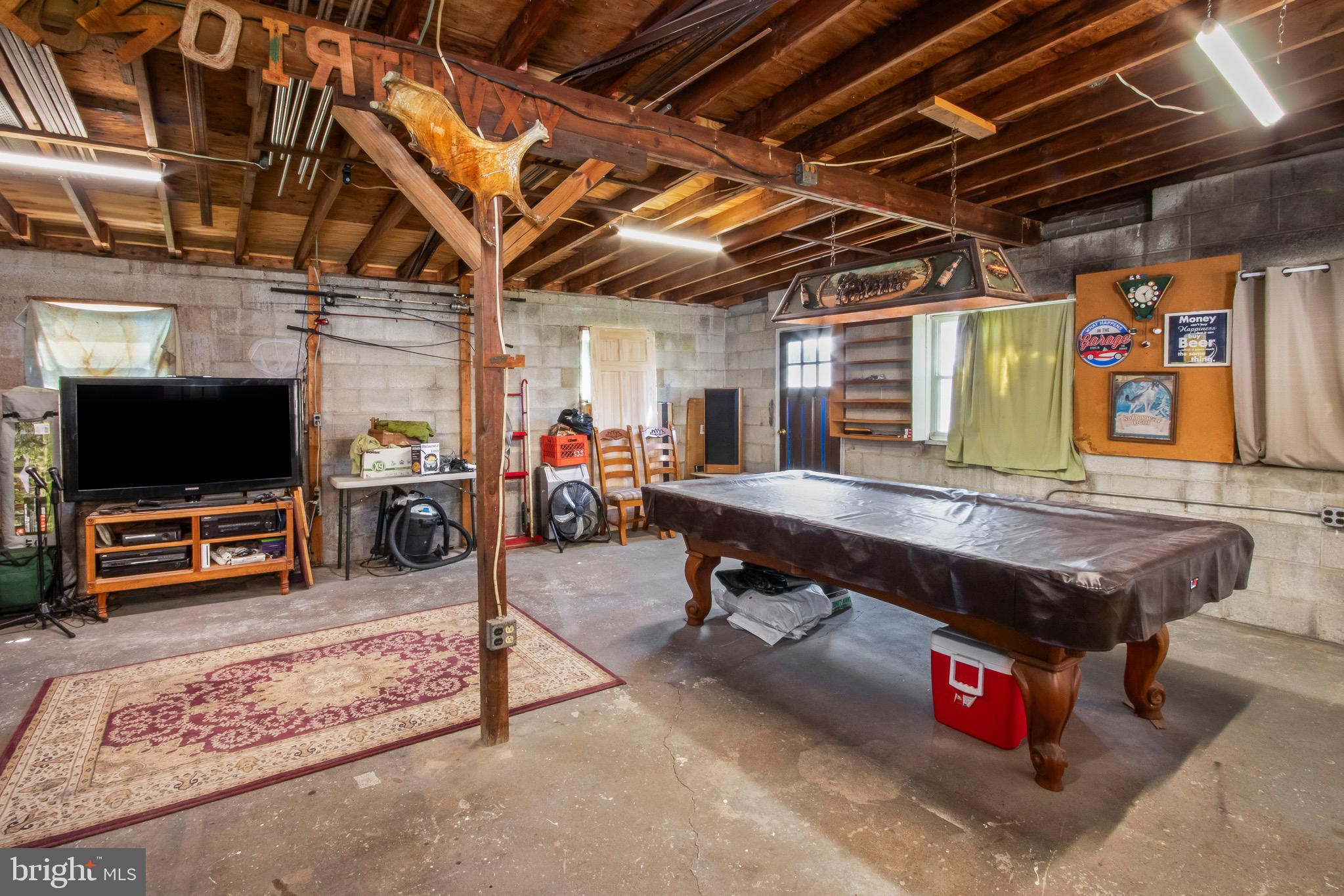 10 South Hook Road Pennsville, NJ 08070 - Photo 34 of 40 a living room with furniture flat screen tv and pool table