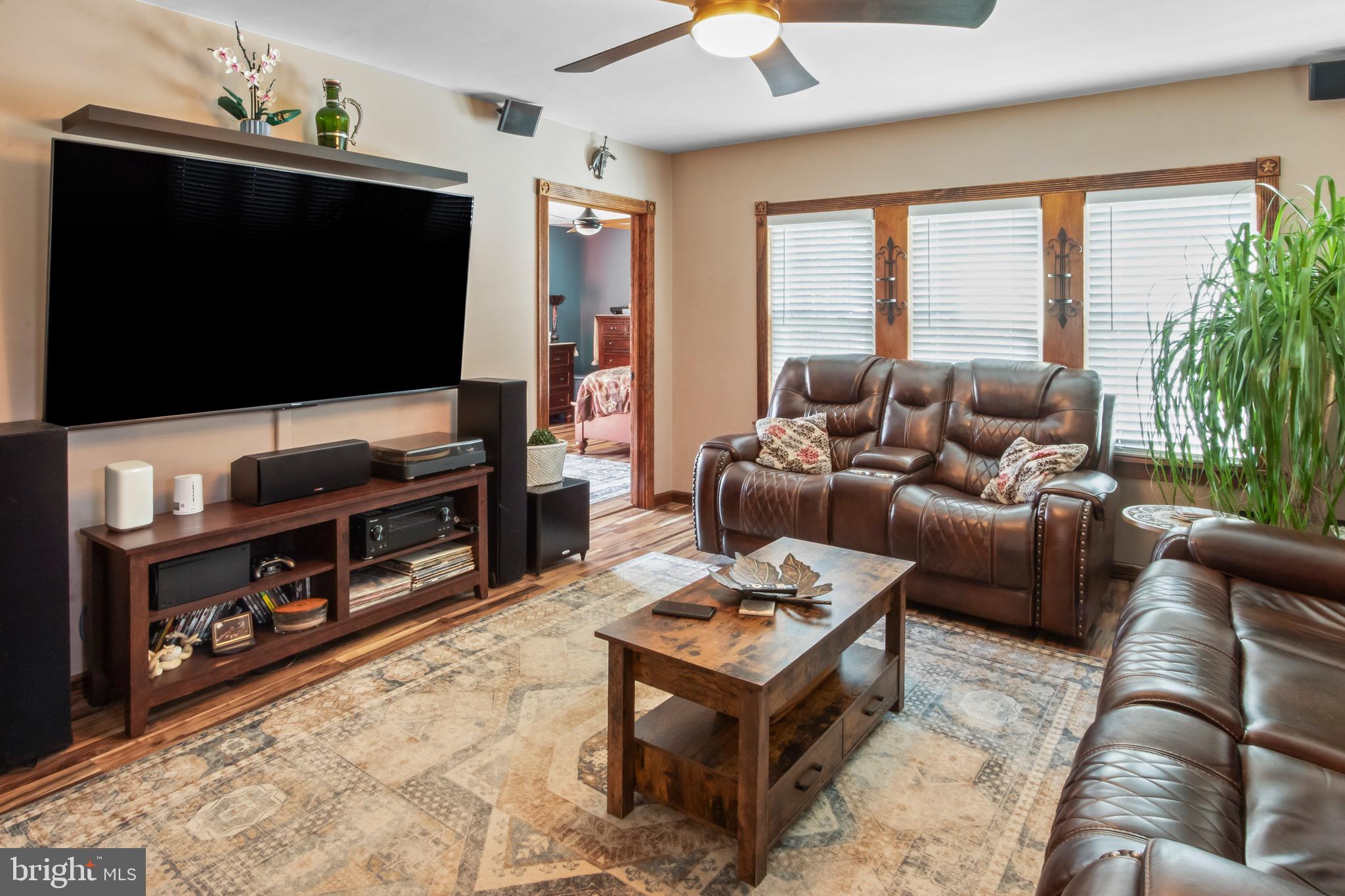 10 South Hook Road Pennsville, NJ 08070 - Photo 8 of 40 a living room with furniture and a flat screen tv