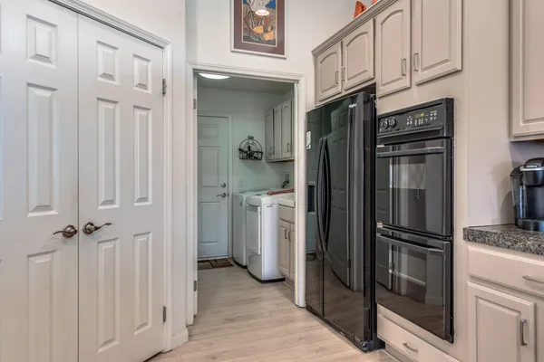 a view of a kitchen with a refrigerator