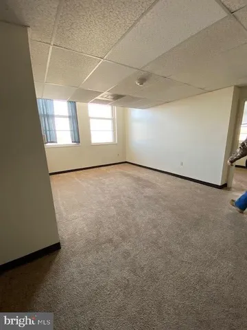 a view of an empty room with a window