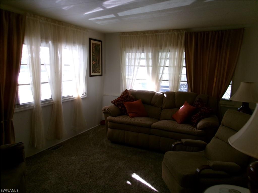 2 Monaco Terrace Naples, FL 34112 - Photo 5 of 24 View of carpeted living room