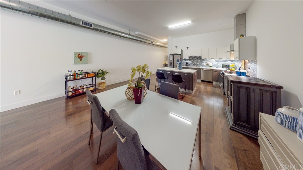 433 Pine Avenue, Unit 308 Long Beach, CA 90802 - Photo 14 of 24 a living room with lots of furniture and wooden floor