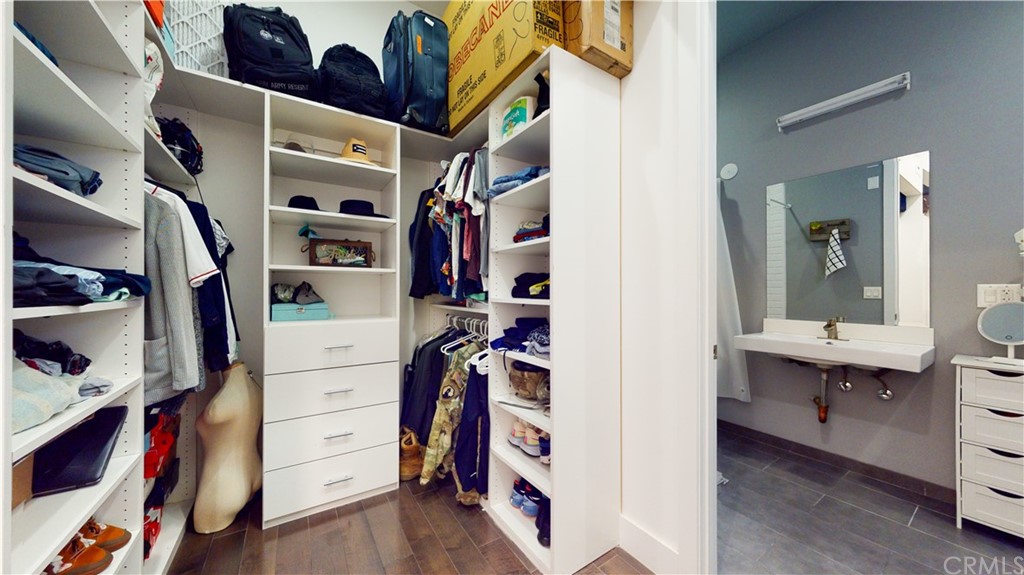 433 Pine Avenue, Unit 308 Long Beach, CA 90802 - Photo 9 of 24 a view of walk in closet with clothes and shoes