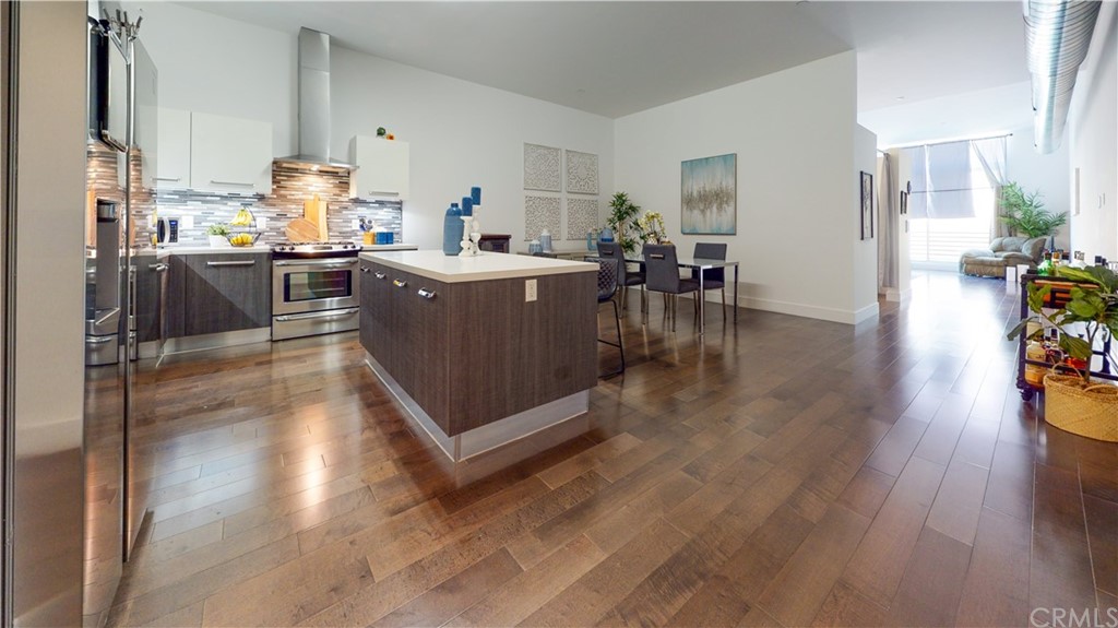 433 Pine Avenue, Unit 308 Long Beach, CA 90802 - Photo 10 of 24 a kitchen with a sink a counter top space and stainless steel appliances
