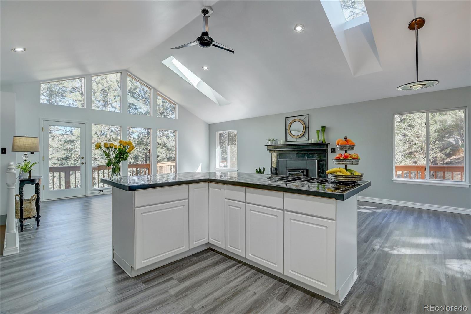 1469 Roland Drive Bailey, CO 80421 - Photo 14 of 39 a kitchen with a sink cabinets and window