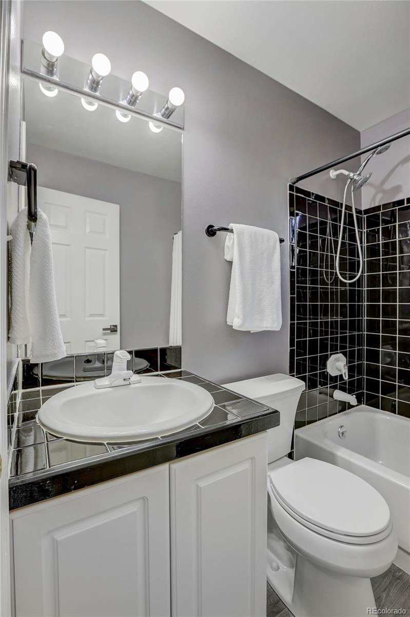 1469 Roland Drive Bailey, CO 80421 - Photo 19 of 39 a bathroom with a sink and a mirror