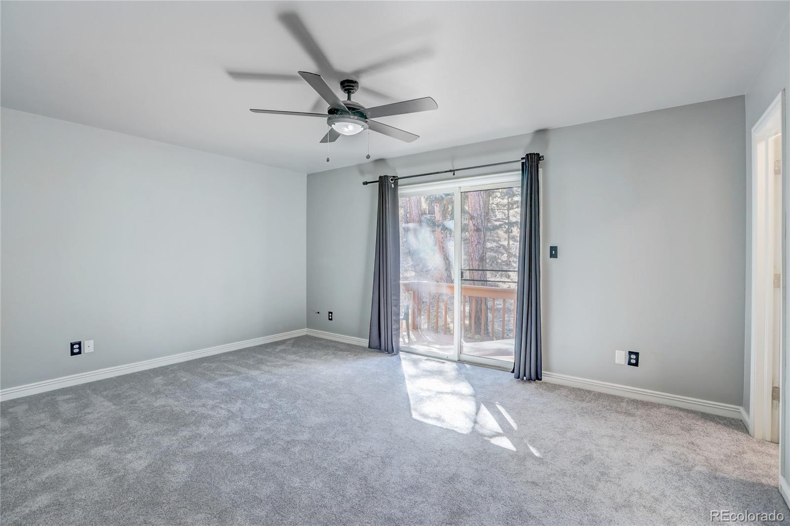 1469 Roland Drive Bailey, CO 80421 - Photo 21 of 39 a view of an empty room with a window
