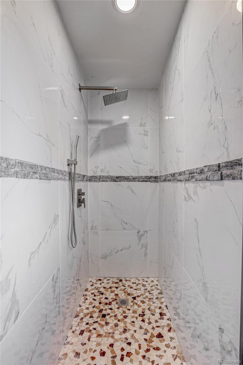 1469 Roland Drive Bailey, CO 80421 - Photo 25 of 39 a bathroom with a shower