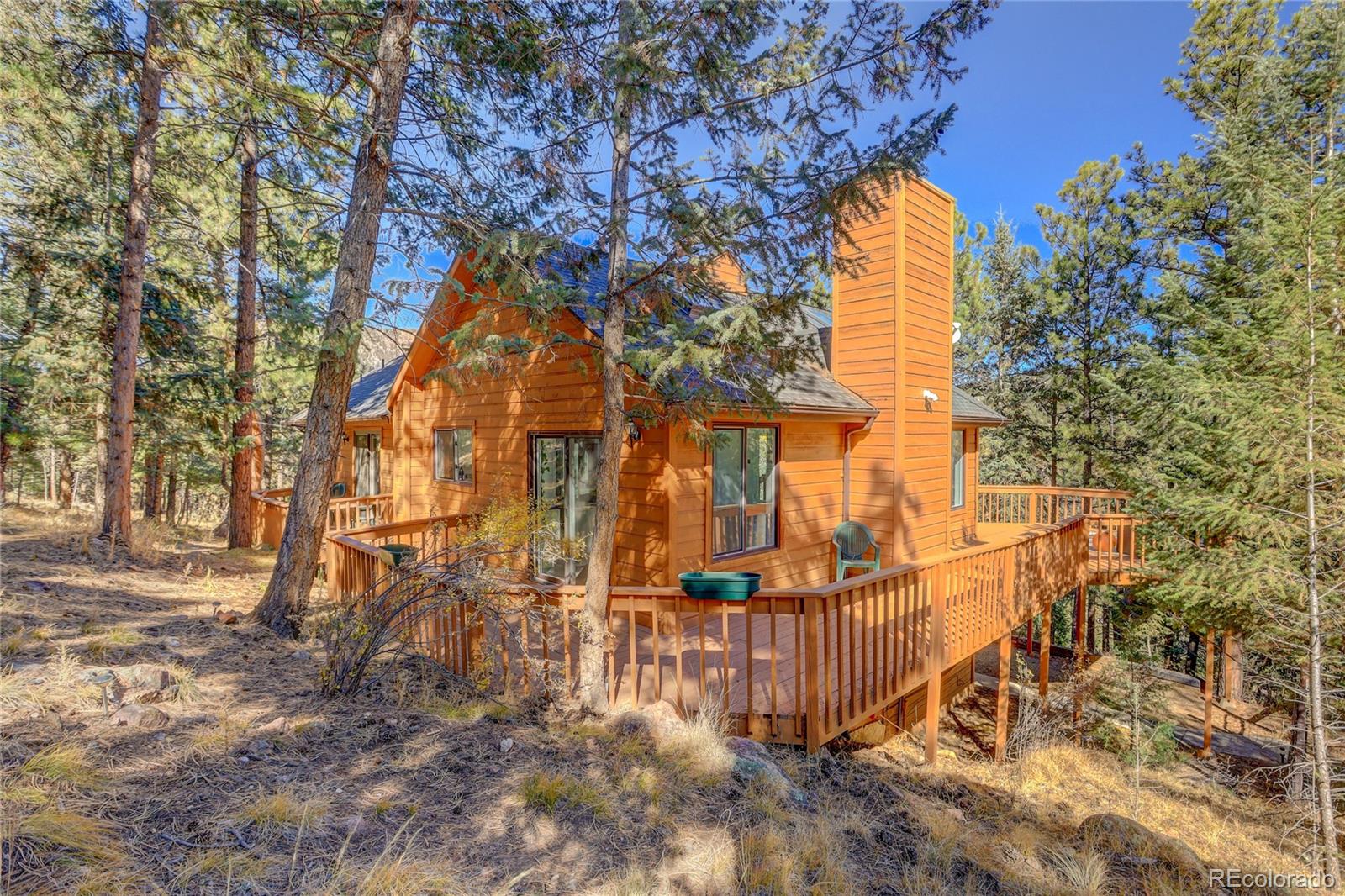 1469 Roland Drive Bailey, CO 80421 - Photo 31 of 39 front view of a house with a yard