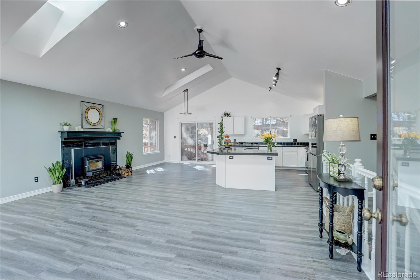 1469 Roland Drive Bailey, CO 80421 - Photo 4 of 39 a view of a kitchen and dining room
