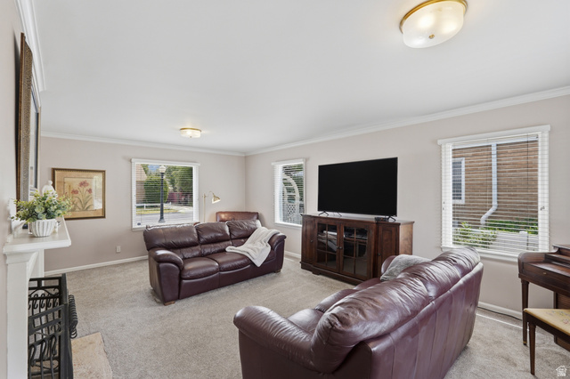 7576 South Jefferson Street Midvale, UT 84047 - Photo 5 of 53 Living area featuring light gray wall paint, crown molding, and recessed lighting