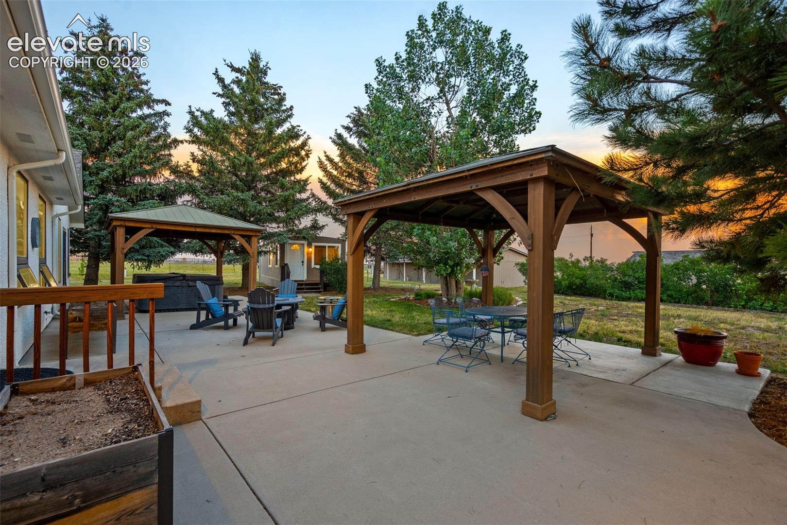 8175 Mohawk Road Colorado Springs, CO 80908 - Photo 6 of 51 Rear patio with 2 gazebos and hot tub