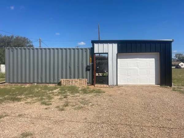 a view of an empty room with a garage