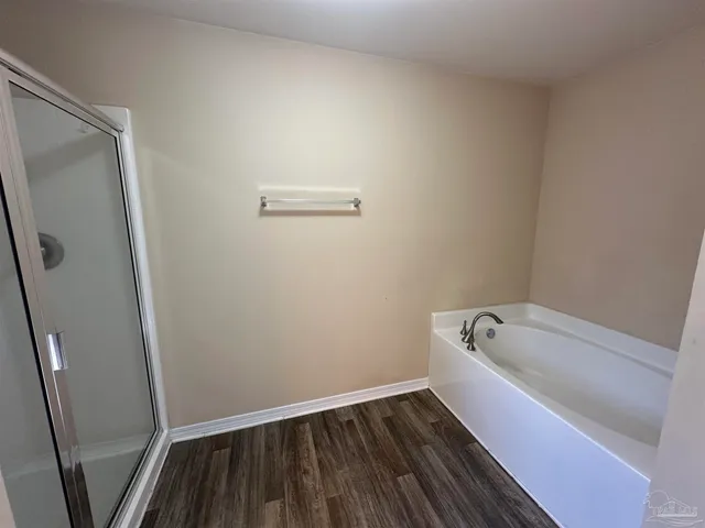a bathroom with a bathtub and toilet