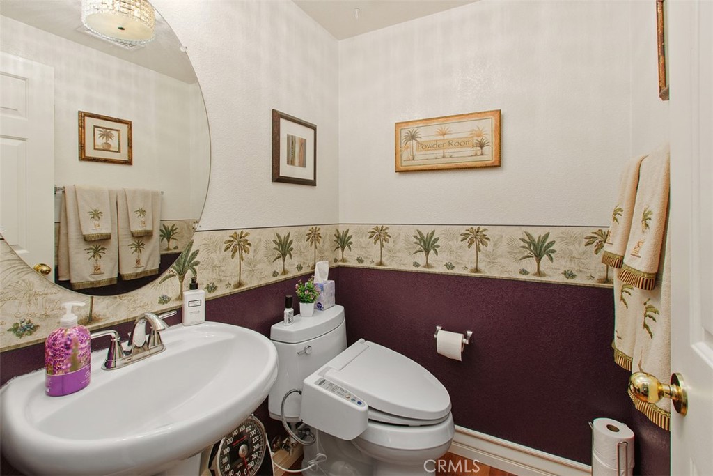 33370 Morning View Drive Temecula, CA 92592 - Photo 11 of 41 a bathroom with a toilet sink and mirror