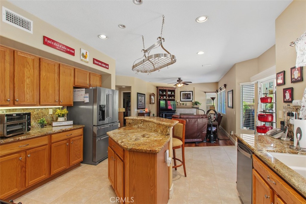 33370 Morning View Drive Temecula, CA 92592 - Photo 17 of 41 a kitchen that has a lot of cabinets a sink and appliances
