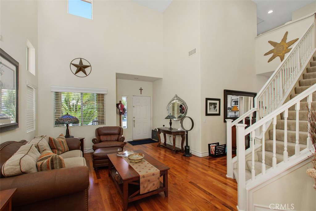 33370 Morning View Drive Temecula, CA 92592 - Photo 29 of 41 a living room with furniture and a floor to ceiling window